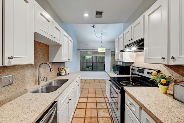 kitchen featuring decorative backsplash, white cabinetry, pendant lighting, and stainless steel appliances