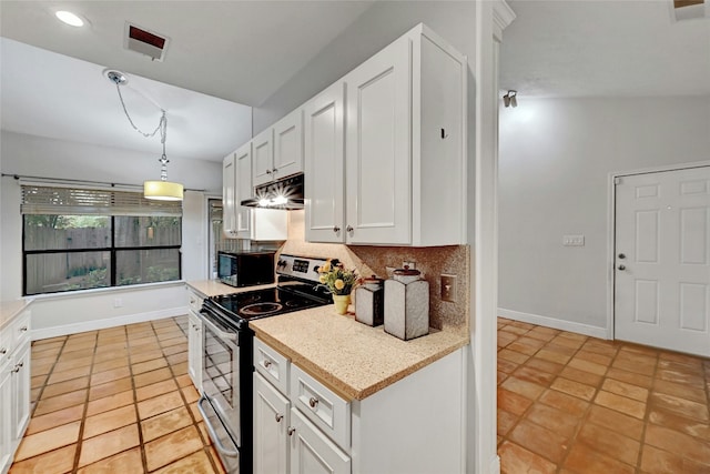 kitchen featuring tasteful backsplash, electric stove, pendant lighting, white cabinetry, and lofted ceiling