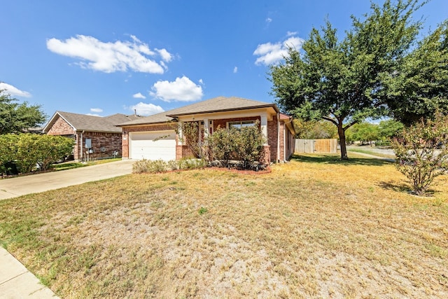 view of front of house featuring a front lawn and a garage