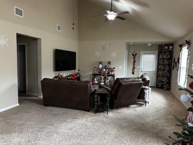 living room featuring carpet floors, ceiling fan, and high vaulted ceiling