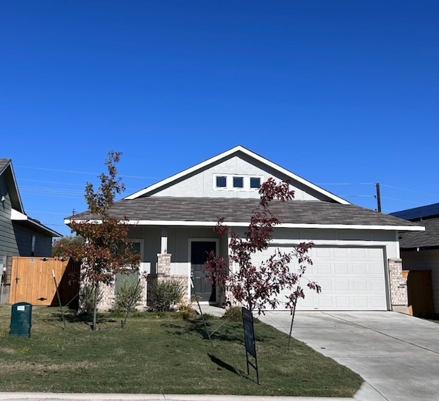 view of front of house with a front lawn and a garage