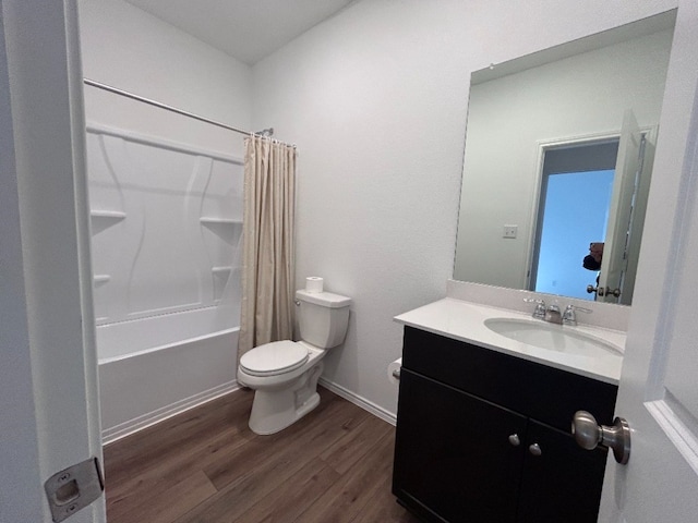 full bathroom with hardwood / wood-style flooring, vanity, toilet, and shower / tub combo