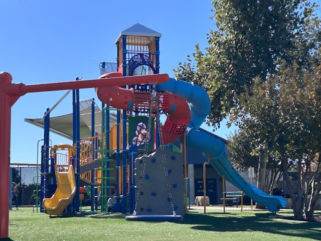 view of jungle gym with a lawn