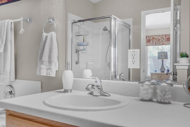 bathroom with vanity and an enclosed shower