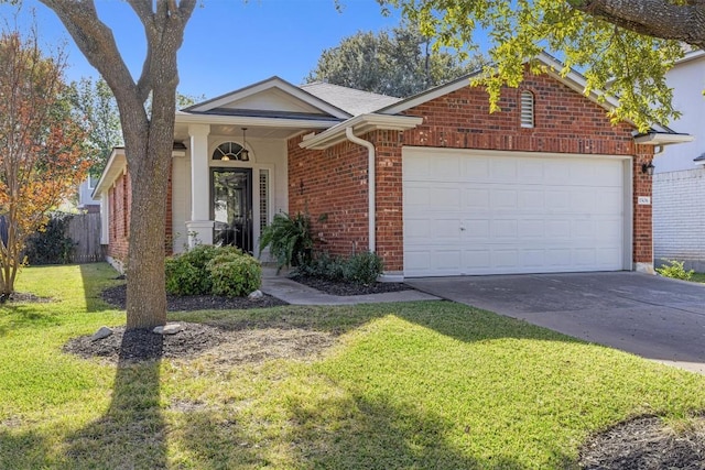 view of front facade with a front yard and a garage