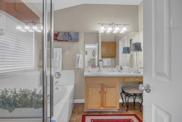 bathroom with tile patterned flooring, vanity, separate shower and tub, and lofted ceiling