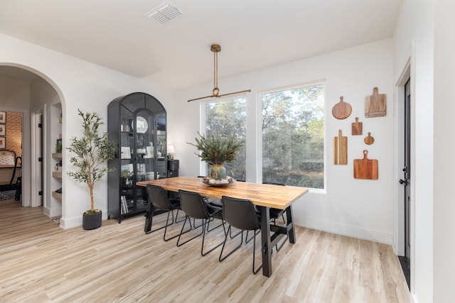 dining area with light hardwood / wood-style floors