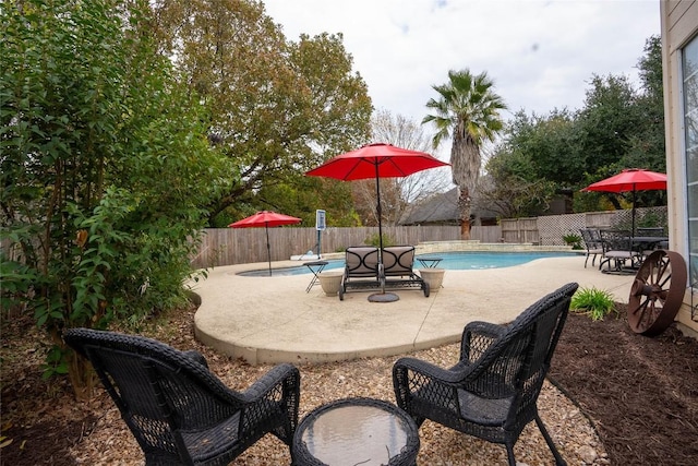 view of patio featuring a fenced in pool