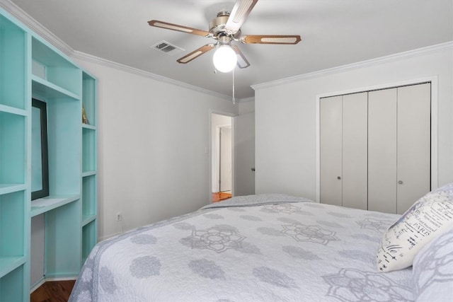 12809 Meehan Dr, Austin, TX 78727 - bedroom featuring ornamental molding, a closet, ceiling fan, and wood finished floors