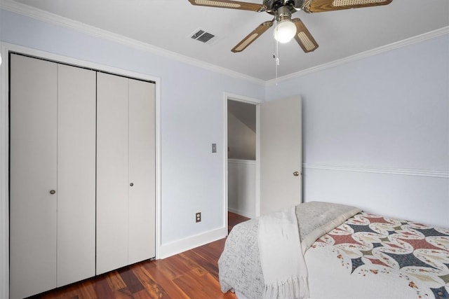 12809 Meehan Dr, Austin, TX 78727 - bedroom with dark wood-type flooring, ornamental molding, a closet, and a ceiling fan
