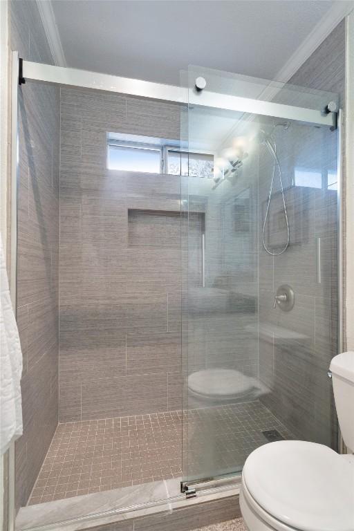 12809 Meehan Dr, Austin, TX 78727 - bathroom with crown molding and a stall shower
