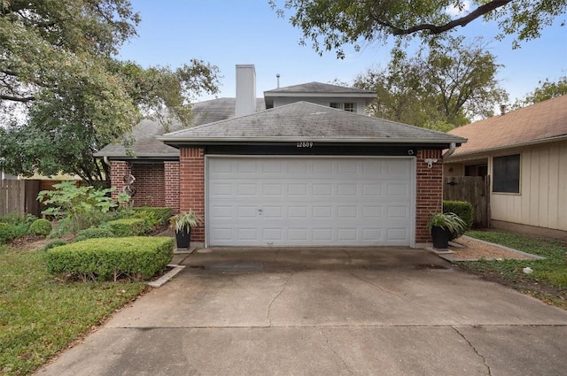 12809 Meehan Dr, Austin, TX 78727 - view of front facade featuring brick siding, a chimney, concrete driveway, and an attached garage