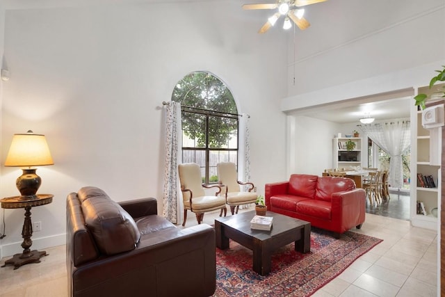 12809 Meehan Dr, Austin, TX 78727 - living room featuring a towering ceiling, ceiling fan, healthy amount of natural light, and light tile patterned floors