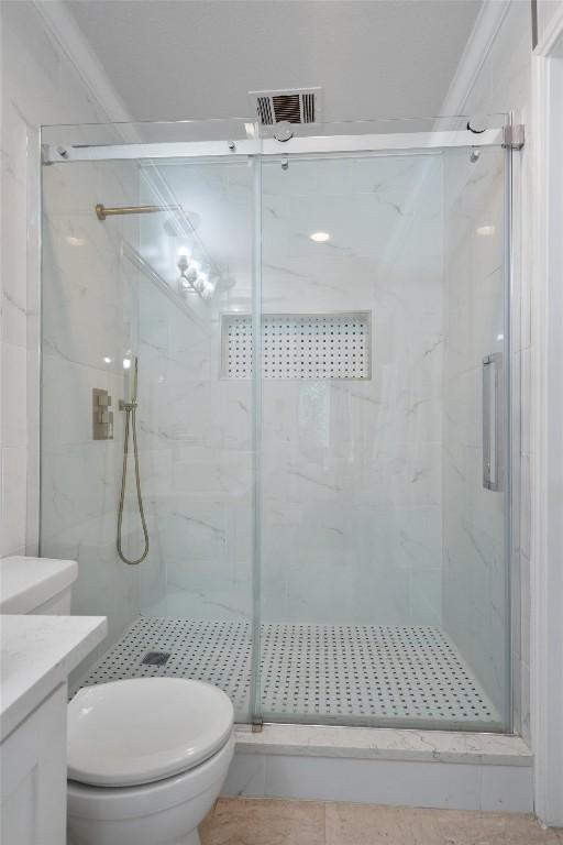 12809 Meehan Dr, Austin, TX 78727 - bathroom featuring a marble finish shower and vanity
