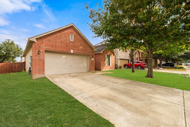 view of front of property featuring a garage and a front lawn