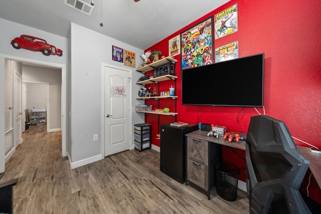 office area featuring ceiling fan and hardwood / wood-style flooring