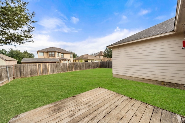 wooden terrace featuring a yard