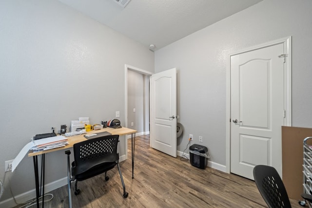 office space with hardwood / wood-style floors