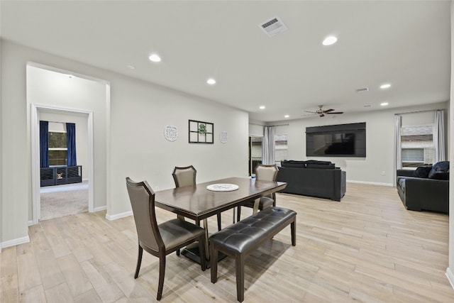 dining room featuring ceiling fan and light wood-type flooring