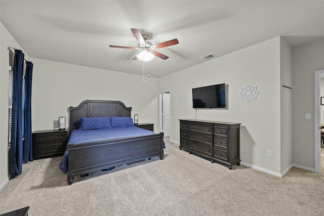 bedroom featuring light carpet and ceiling fan