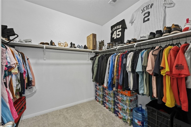 spacious closet featuring carpet floors