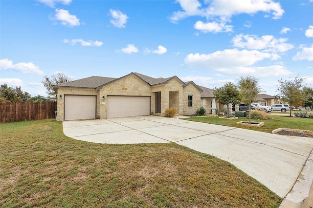 view of front of home featuring a garage and a front yard