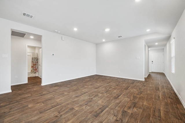 unfurnished room featuring dark wood-type flooring