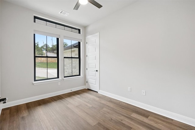 unfurnished room featuring ceiling fan and light hardwood / wood-style floors