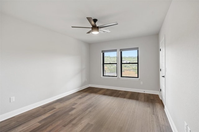 spare room featuring hardwood / wood-style flooring and ceiling fan