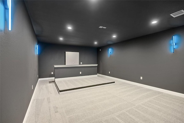 empty room featuring light carpet