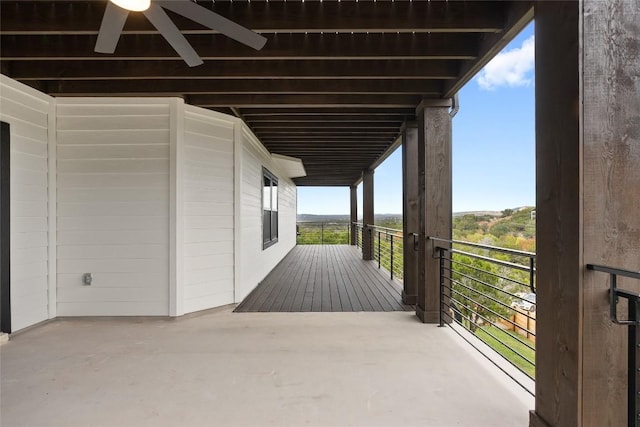 exterior space with ceiling fan