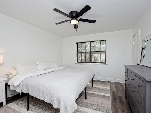 bedroom featuring ceiling fan and dark hardwood / wood-style flooring