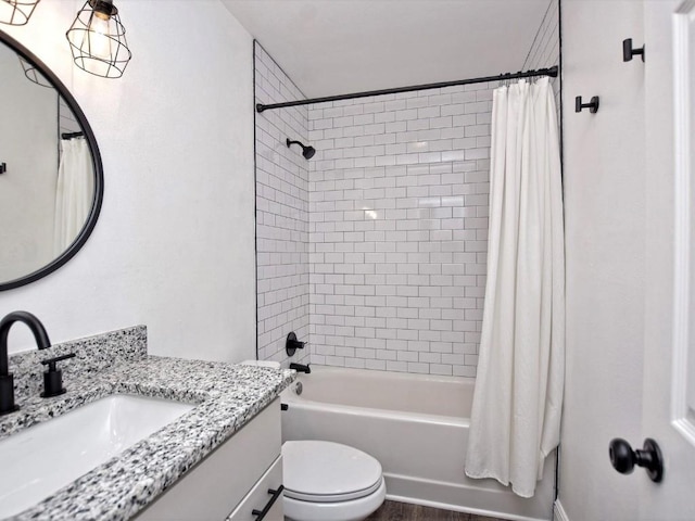 full bathroom featuring shower / tub combo with curtain, vanity, and toilet