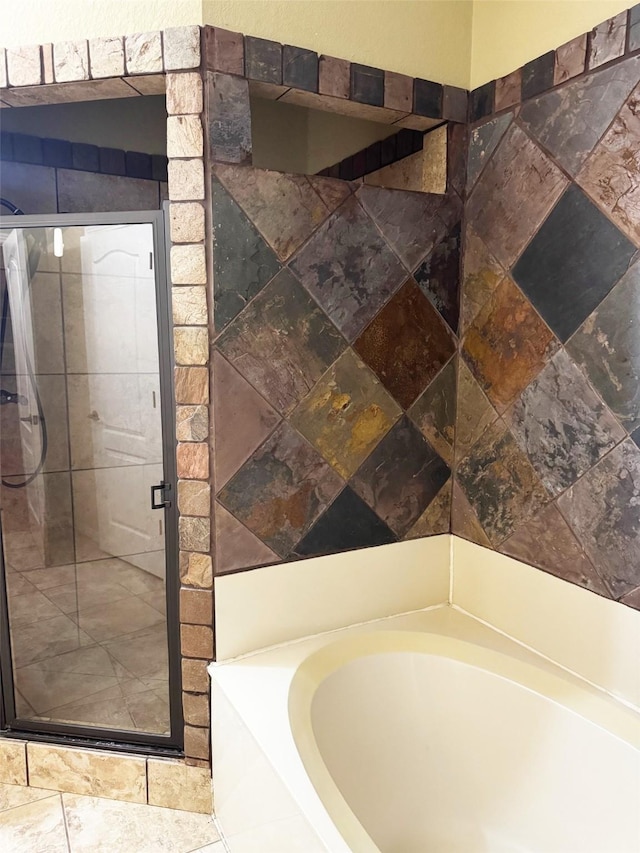 bathroom with tile patterned floors and plus walk in shower