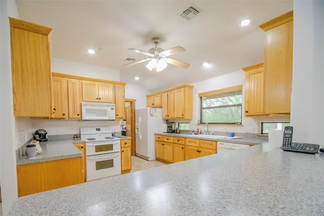 kitchen featuring light brown cabinetry, ceiling fan, sink, and white appliances