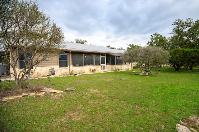 view of yard with a sunroom