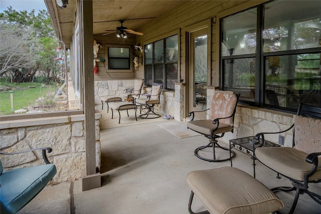 view of patio featuring ceiling fan