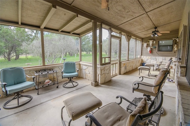 sunroom featuring ceiling fan