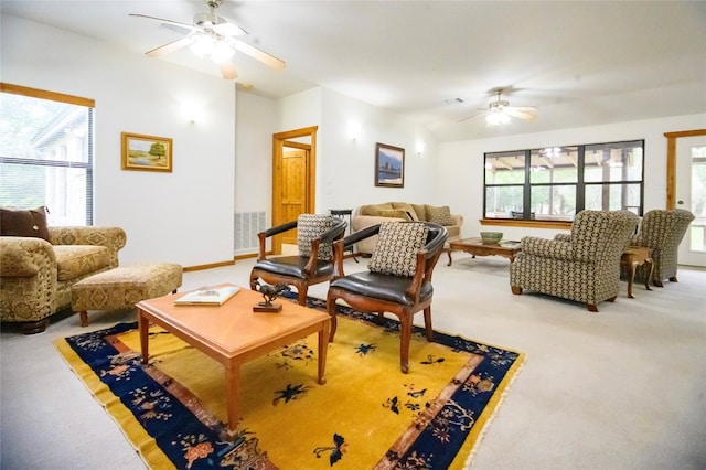 carpeted living room featuring ceiling fan