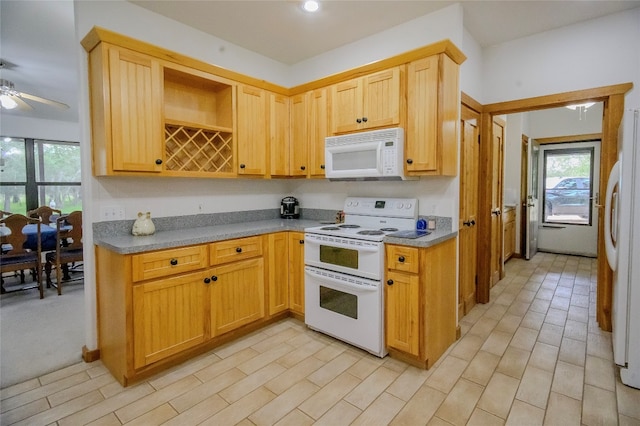 kitchen with ceiling fan and white appliances