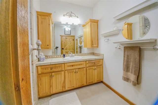 bathroom with ceiling fan and vanity