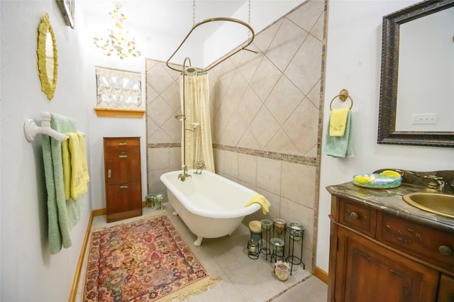 bathroom with tile patterned floors, shower / tub combo, vanity, and tile walls