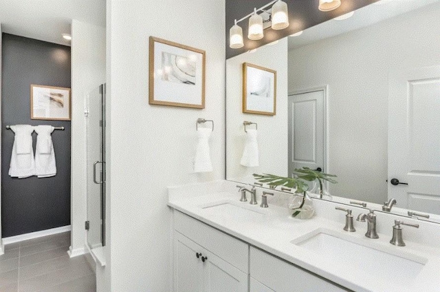 bathroom with tile patterned flooring and vanity