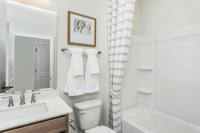 full bathroom with vanity, shower / bathtub combination with curtain, and toilet