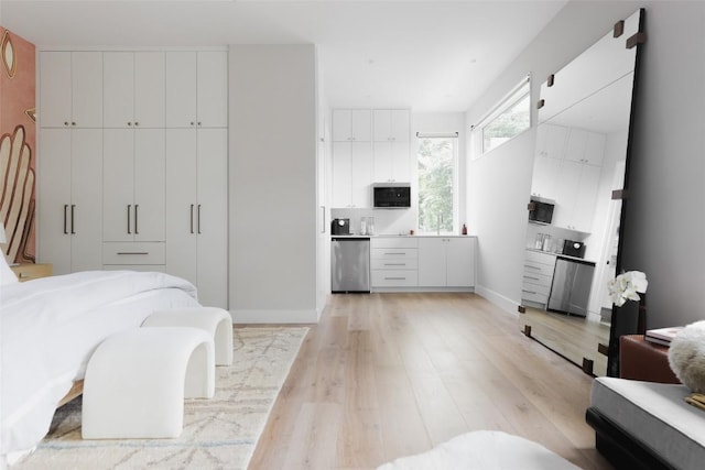 bedroom featuring a closet and light hardwood / wood-style flooring