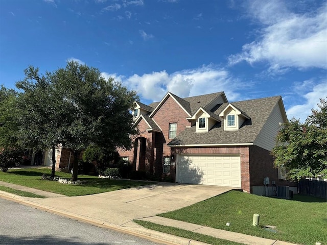 view of front of house with a front lawn and a garage