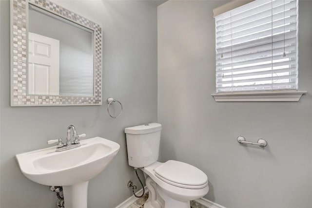 bathroom featuring sink and toilet