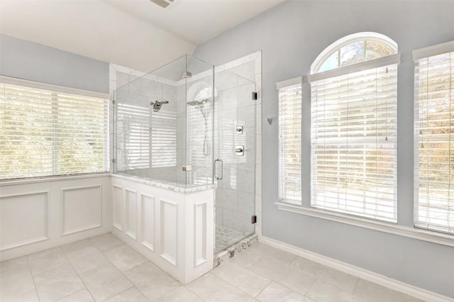 bathroom featuring tile patterned floors and an enclosed shower