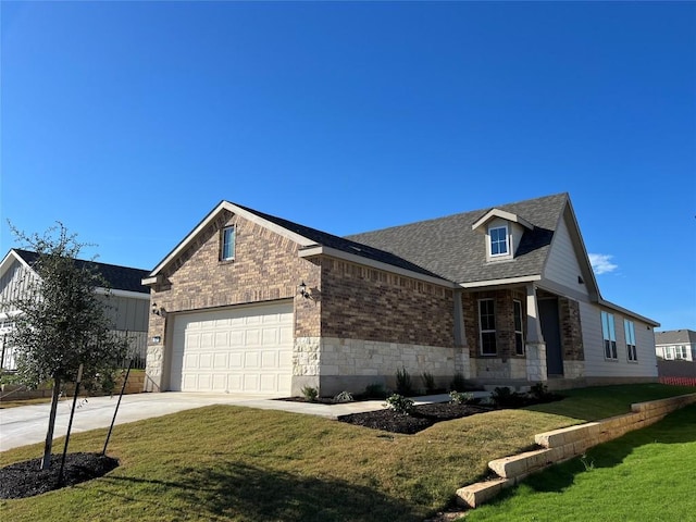 view of side of home with a garage, a shingled roof, concrete driveway, a yard, and brick siding