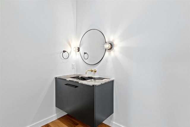 2206 Trail Of The Madrones, Austin, TX 78746 - bathroom with vanity and wood-type flooring